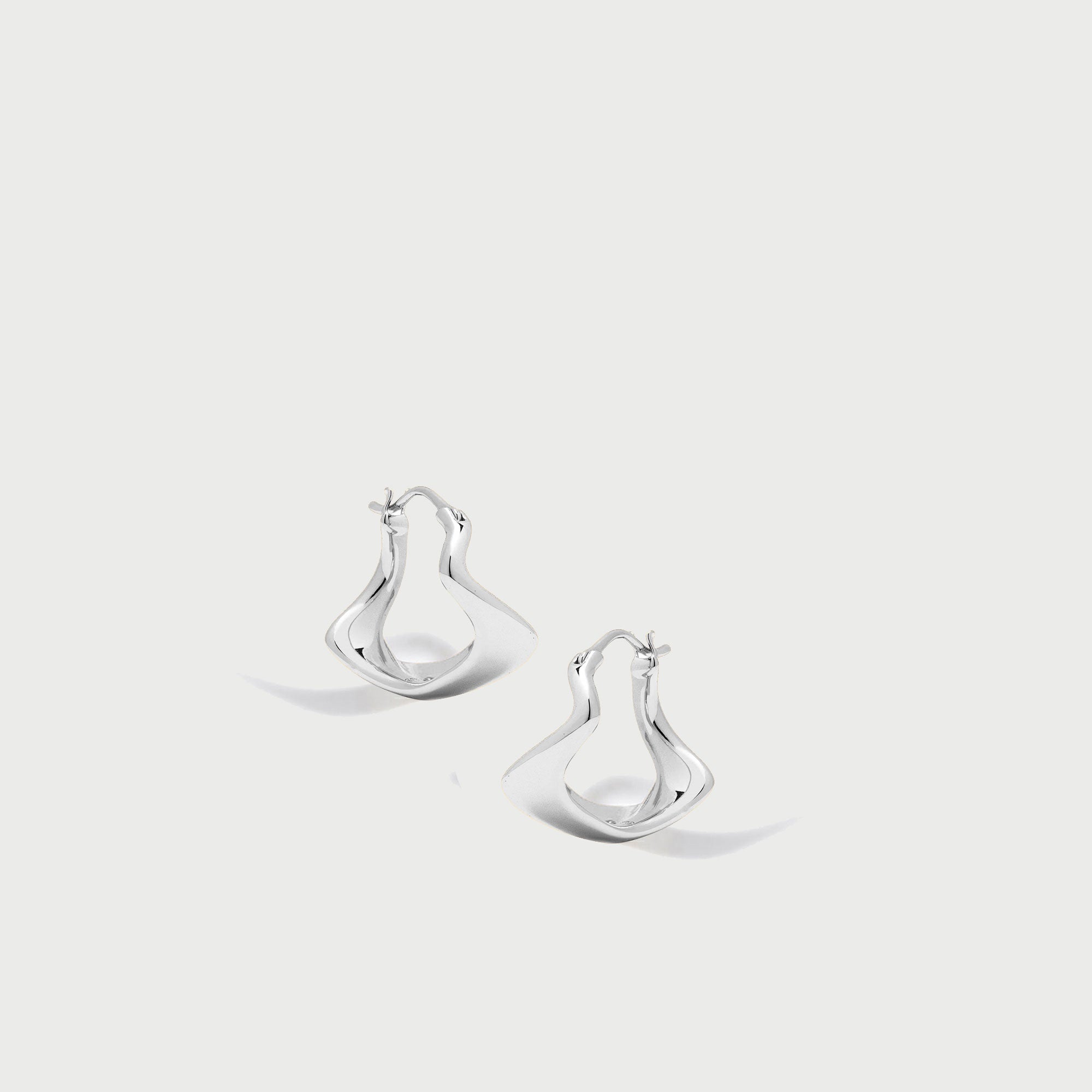 Curved Mini Hoop Earrings in Silver